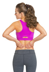 Female athlete having backache