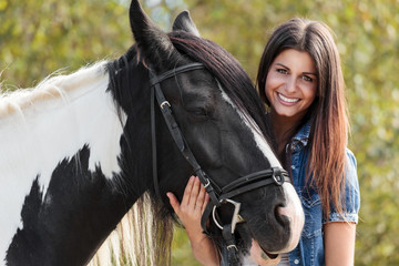cropped view of young female rider smiling