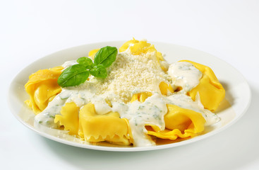 Ricotta and spinach tortelloni with cream sauce and Parmesan