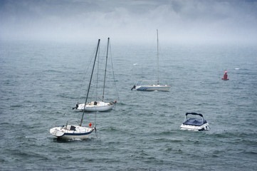 boats in stormy sea