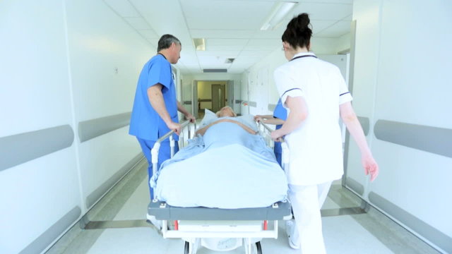Patient Hospital Bed Moved by Medical Staff Slow Motion