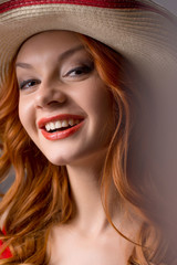 Red hair beauty. Portrait of beautiful young red hair woman in h