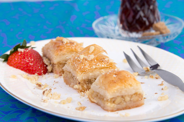 Baklava Garnished with Strawberry and Walnuts