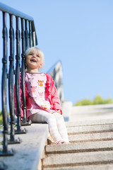 Cute little girl looking into the sky