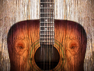 Acoustic guitar art on wooden background