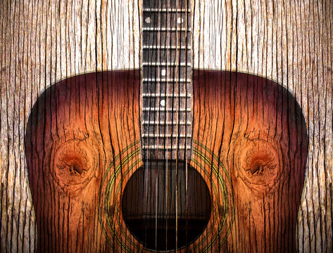 Acoustic guitar art on wooden background