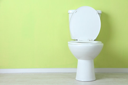 White Toilet Bowl In A Bathroom