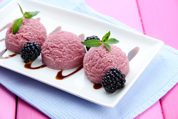 Delicious ice cream on plate on table close-up