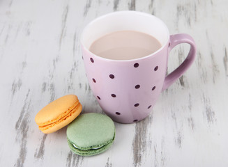 Cocoa drink, macaroni and cocoa beans on wooden background