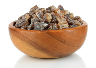 Caramelized sugar in bowl isolated on white