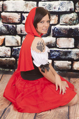 woman red cape tattoo claw serious
