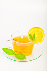 tea in cup with leaf mint and lemon
