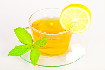 tea in cup with leaf mint and lemon