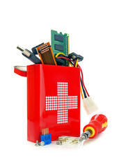 Computer repairs concept components and tools in first aid tin