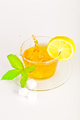 tea in cup with leaf mint and lemon