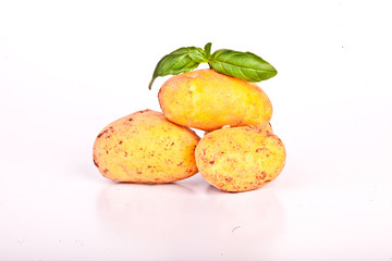 Little yellow patatos sliced on pure white background 