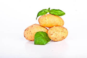 Little yellow patatos sliced on pure white background 