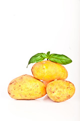 Little yellow patatos sliced on pure white background 