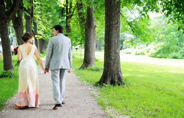 Fototapeta na wymiar Bride and groom walking together