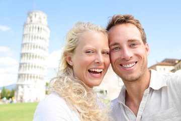 Young couple happy having fun on travel to Pisa