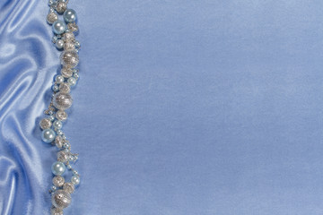 Delicate satin background with beads
