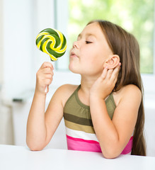 Little girl with lollipop