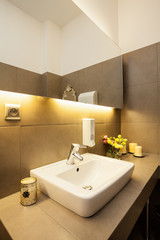 White ceramic sink on grey countertop
