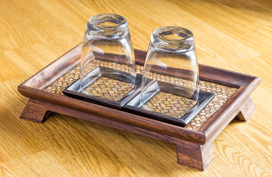 Glass on wooden tray at spa
