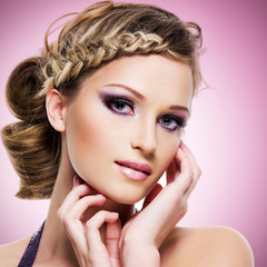 woman with fashion hairstyle and pink makeup