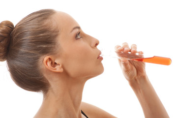 woman drinks red liquid from a test tube