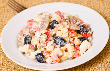 Fresh vegetable salad with mushrooms and olives