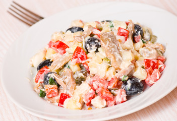 Fresh vegetable salad with mushrooms and olives
