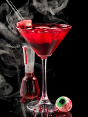 Red bloody Halloween cocktail with smoke
