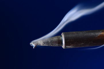 Hot soldering iron with smoke