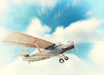 Old biplane in the sky