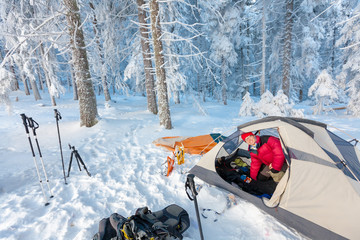 Camping during winter hiking in Carpathian mountains