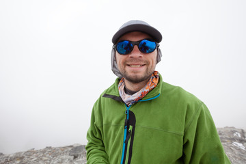 Hiker posing at camera on the trek in Himalayas, Nepal
