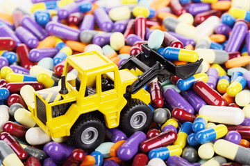 Industrial tractor toy load pills and tablets