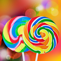 Colorful spiral lollipop isolated on a colored