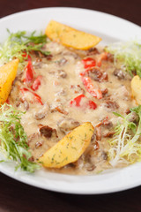 meat with sauce and vegetables