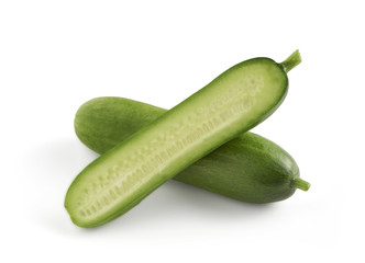 two mini snack cucumbers one sliced in halve
