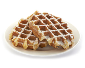 two belgian waffles served on a plate