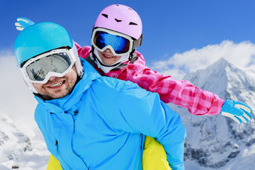 Fototapeta na wymiar Ski, winter, sun and fun - family enjoying winter