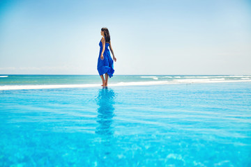 woman on the infinite water - freedom concept 