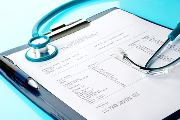 Blood test results with stethoscope in a clipboard