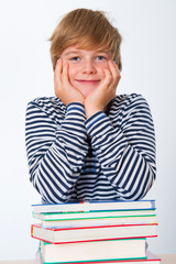 smiling boy with his books