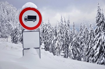 Stop traffic sign in the snowy forest