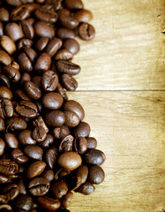 Coffee beans on vintage wooden background