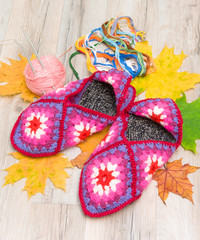 a pair of knitted slippers close-up