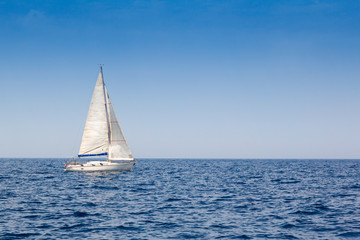 beautiful sailboat with a white sail